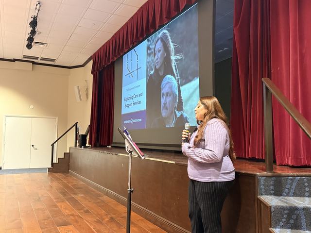 A presentation on stage at Caregivers’ Day