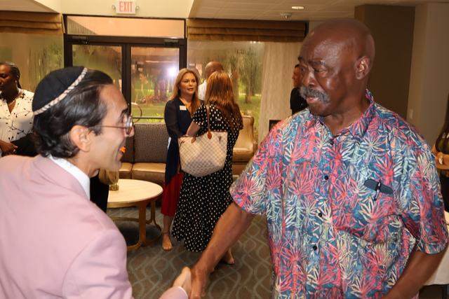 Dr. Erik talking with an attendee