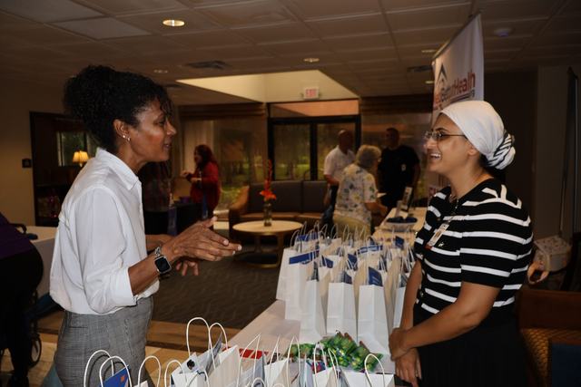 Attendees visiting a resource table